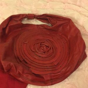 Red Valentino Garavani leather rose purse.
